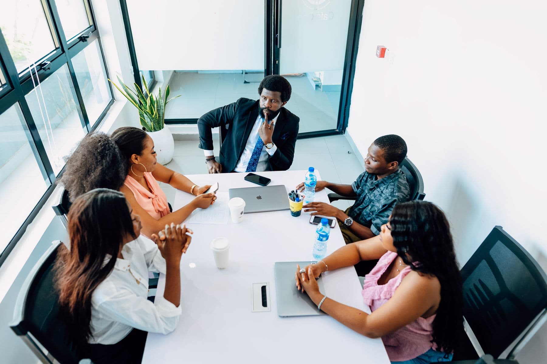 Members around a table in a planning meeting